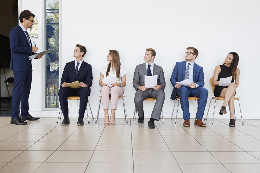 Recruiter and people waiting for job interviews, full length